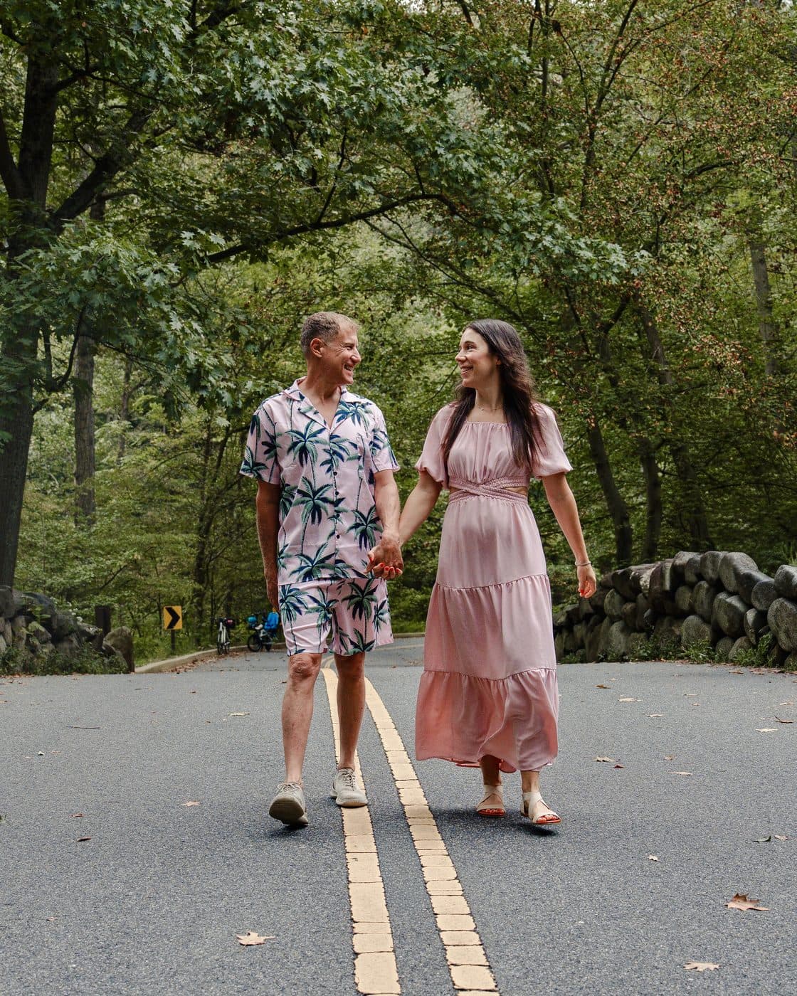 Chuck Brodsky and Michelle Harburg, co-founders of MediNav, walking together outdoors.